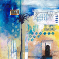blue and yellow moroccan building and palm tree