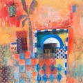 moroccan facade and doorway in oranges with decorative tiles and palm tree